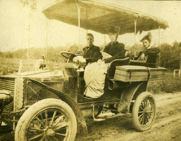 Spencer's son driving a steam car that Christopher designed.