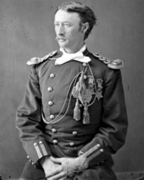 Army Capt. Thomas Custer wearing a dress uniform and two Medals of Honor poses for a photo.