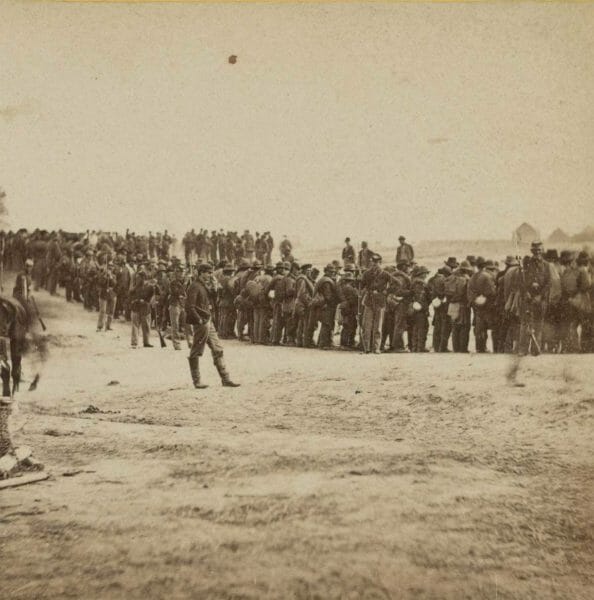 Confederate prisoners are guarded by Union soldiers after being captured by Gen. Philip Sheridan at the Battle of Five Forks, April 3, 1865, after the storming of Petersburg, Va.