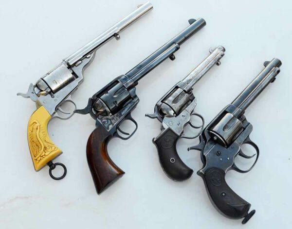 Four Colt revolvers from l to r: Colt 1872 Open Top, Colt 1873 SAA, Colt 1877, Colt 1878