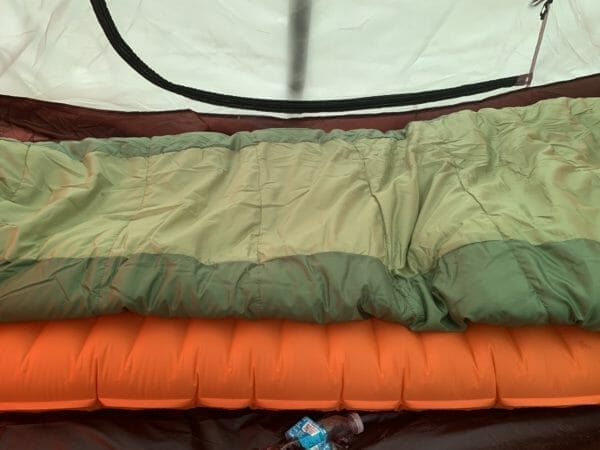 The Alps Mountaineering Nimble Air Mat is the most compact and yet tallest sleeping pad that I have seen.