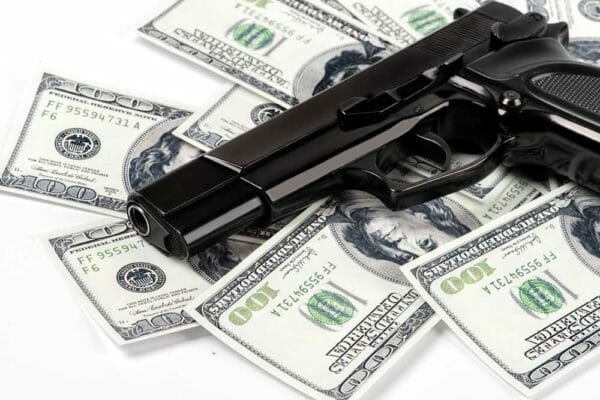 guns money iStock-515708952