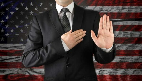 oath in front of the American flag iStock-chargerv8-595348492.jpg