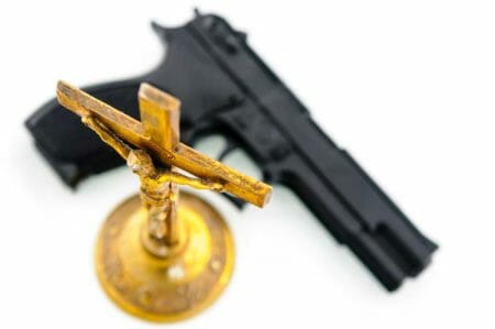 Religion Gun iStock-970957434