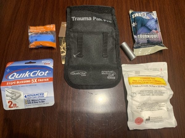 The Adventure Medical Kit Trauma Pak Pro comes with QuikClot Gauze, SWAT-T Tourniquet, Nitrile Glove, Trauma Pad, Duct Tape and instructions.