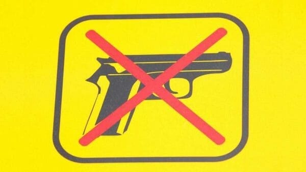 No Guns Yellow Sign NRA-ILA Shutterstock.com sign weapon b620918192