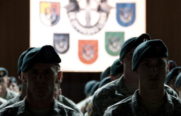 Graduates of the Special Forces Qualification Course don their Green Berets for the first time. (Official U.S. Army photo). 