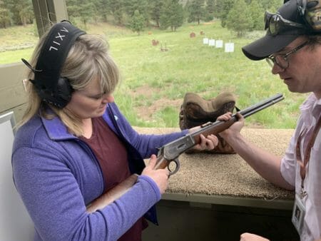 Instructor Tygh Campbell showing my wife Katy how to shoot the old 1896 Winchester 45-70. Katy loved the Axil TrackR Electronic ear muffs.