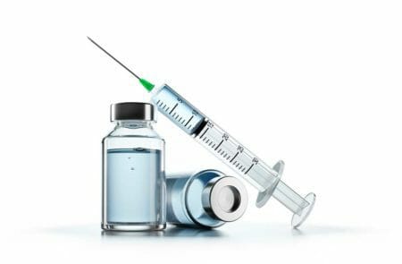 Medical Syringe With Vaccine Vaccinations iStock-peterschreiber.media-1263021678