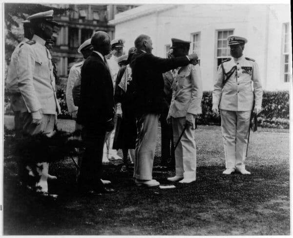 Navy Cmdr. Claud A. Jones receives the Medal of Honor from President Herbert Hoover during a ceremony at the White House, Aug. 24, 1932. Jones' wife and son are partially visible behind him and the president. Jones received the medal for heroism aboard the USS Memphis after it was wrecked during a tropical disturbance on Aug. 29, 1916. 