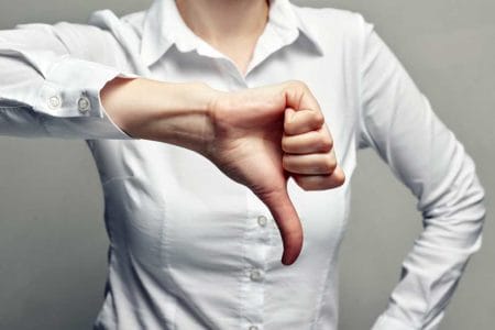 Business Woman Thumb Down Vote No iStock-Lazy_Bear 1137891404