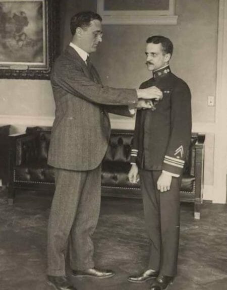 Franklin Delano Roosevelt pins the Medal of Honor