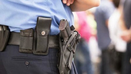 Police pistol holster NRA-ILA police officer Shutterstock 133615913