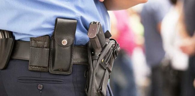 Police pistol holster NRA-ILA police officer Shutterstock 133615913