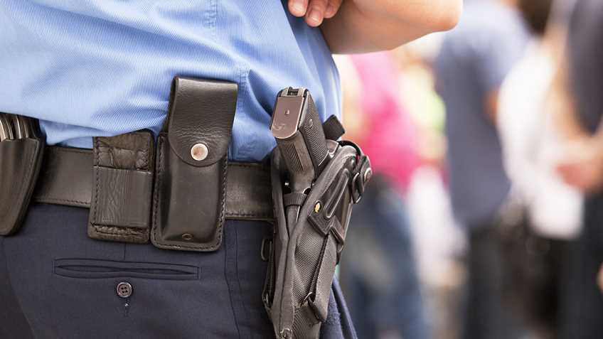 Police pistol holster NRA-ILA police officer Shutterstock 133615913