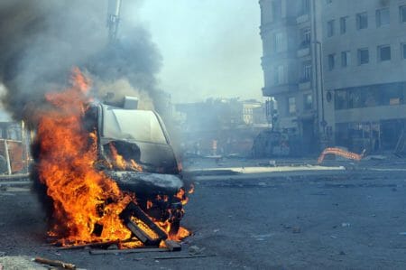 Riot Burning Car iStock-532226067