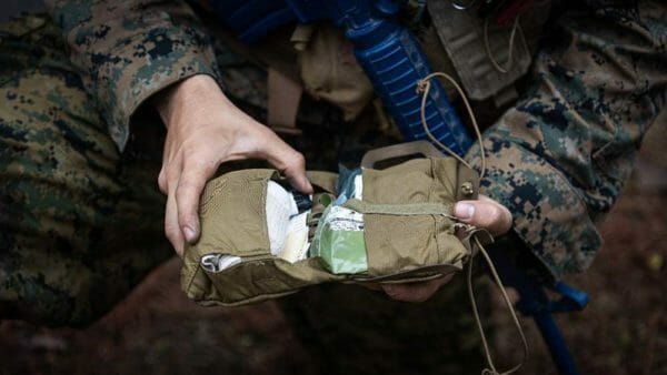 A U.S. Navy Corpsman assigned to Field Medical Training Battalion-East, deploys a ReFlex™ Med Roll on a simulated casualty during a field training exercise at Marine Corps Base Camp Lejeune, N.C.