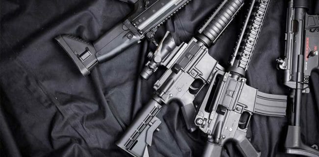 AR15 pile of Guns Rifles SMG iStock FabrikaCr 949369336