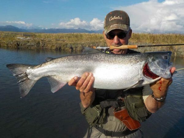 When you're fishing in bear country in waders you absolutely cannot wear a conventional waist holster. You'd be eaten alive before you ever got it dug out. Wear a shoulder holster.