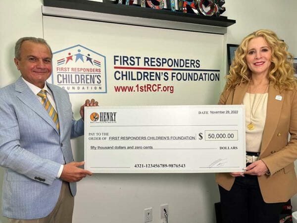 Henry Repeating Arms CEO & Founder Anthony Imperato (L) presenting a $50,000 donation to FirstResponders Children’s Foundation President & CEO Jillian Crane (R) at the organization’s headquarters in
New York City.