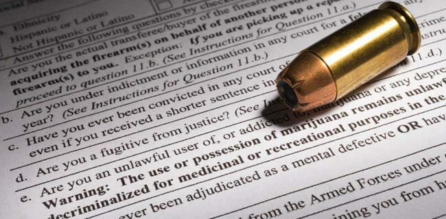 NICS Background Check Marijuana Exclusion ATF Form 4473 Firearms Transaction Record Question. iStock-919659526