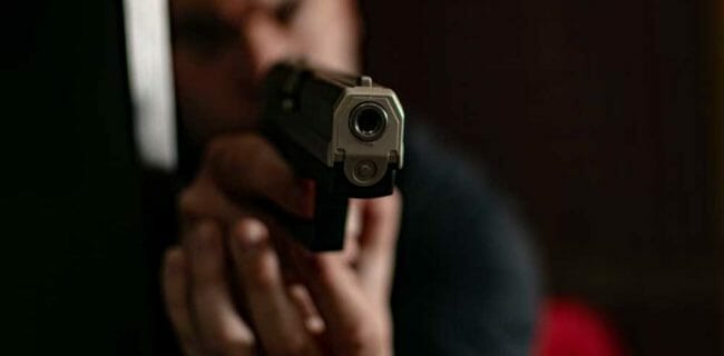 Armed Defender Ends Attack on the Road, iStock-1354934183