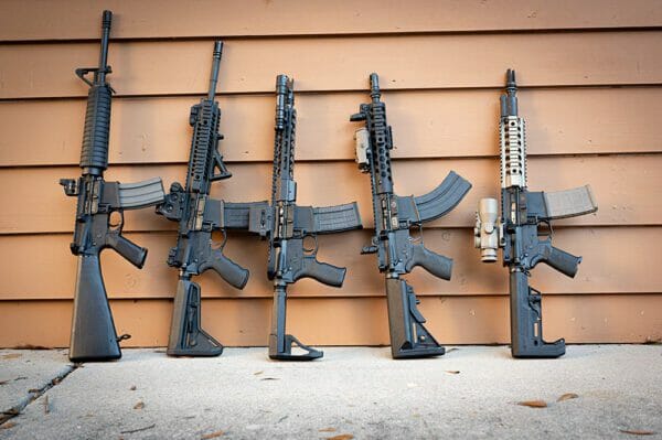 several AR 15 rifles and barrels with braces andmuzzel devices.