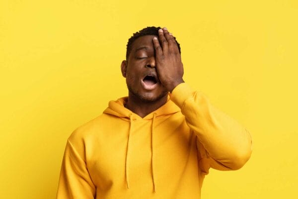 Face Palm Black man covering his eye while annoyed, upset or ashamed iStock-Prostock-Studio 2058883831
