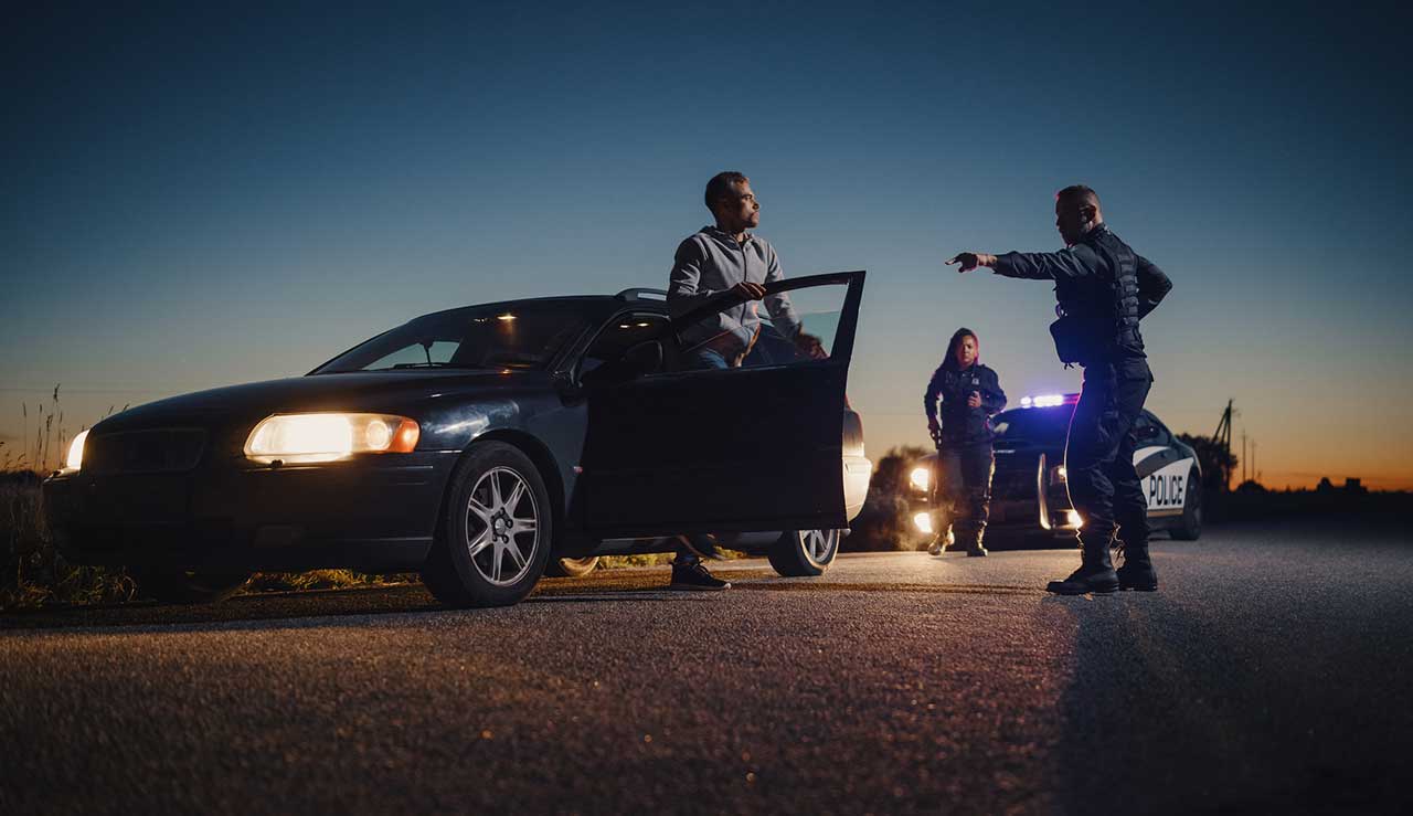 Police Officer Ordering a Driver to Get Out of the Vehicle and Put His Hands on the Hood car search iStock-gorodenkoff 1480291483.jpg