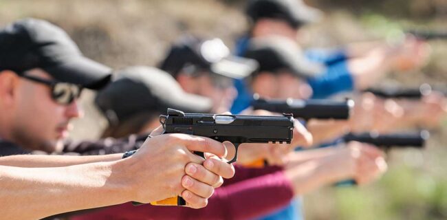 gun range concealed carry Young people on tactical gun training classes. Shooting and Weapons iStock-guruXOOX 1305500703