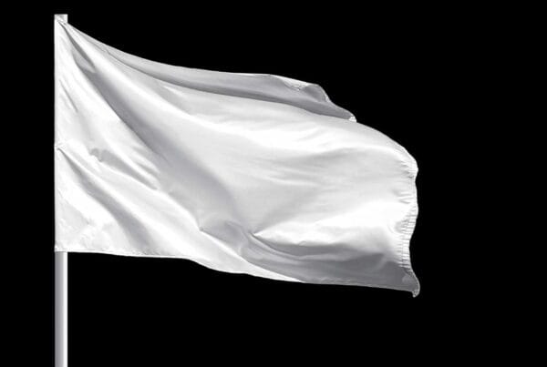 white flag on flagpol surrender iStock-AlxeyPnferov 1411569800
