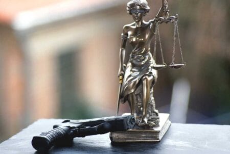 Scales of Justice Gun Laws Court Gavel Judges iStock-Denise Hasse1136158583