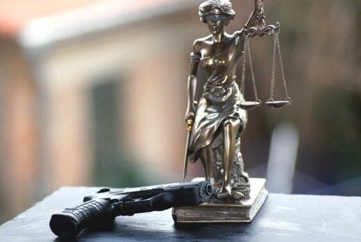 Scales of Justice Gun Laws Court Gavel Judges iStock-Denise Hasse1136158583