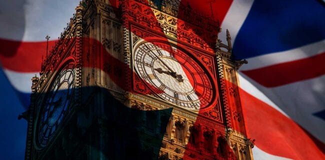 Union jack flag and iconic Big Ben at the palace of Westminster London UK united kingdom iStock-melis 82672219580.jpg