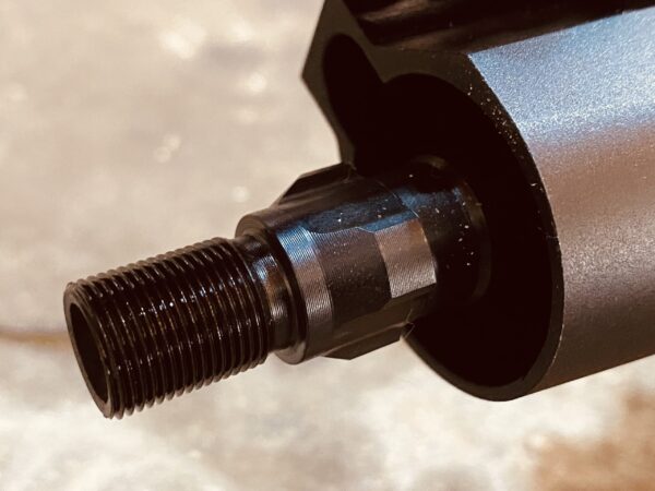 You have the option of 1/2x28 direct thread or a tri-lug mount. Classic subgun stuff.
