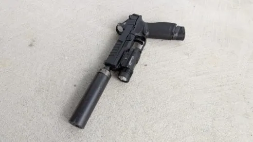 Springfield Echelon 9mm handgun equipped with a SilencerCo Spectre 9 Suppressor and a Shield RMSc red dot.