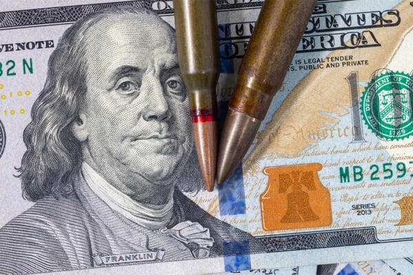 Guns Ammo Cash Money iStock-Sergii Zysk 2204081219