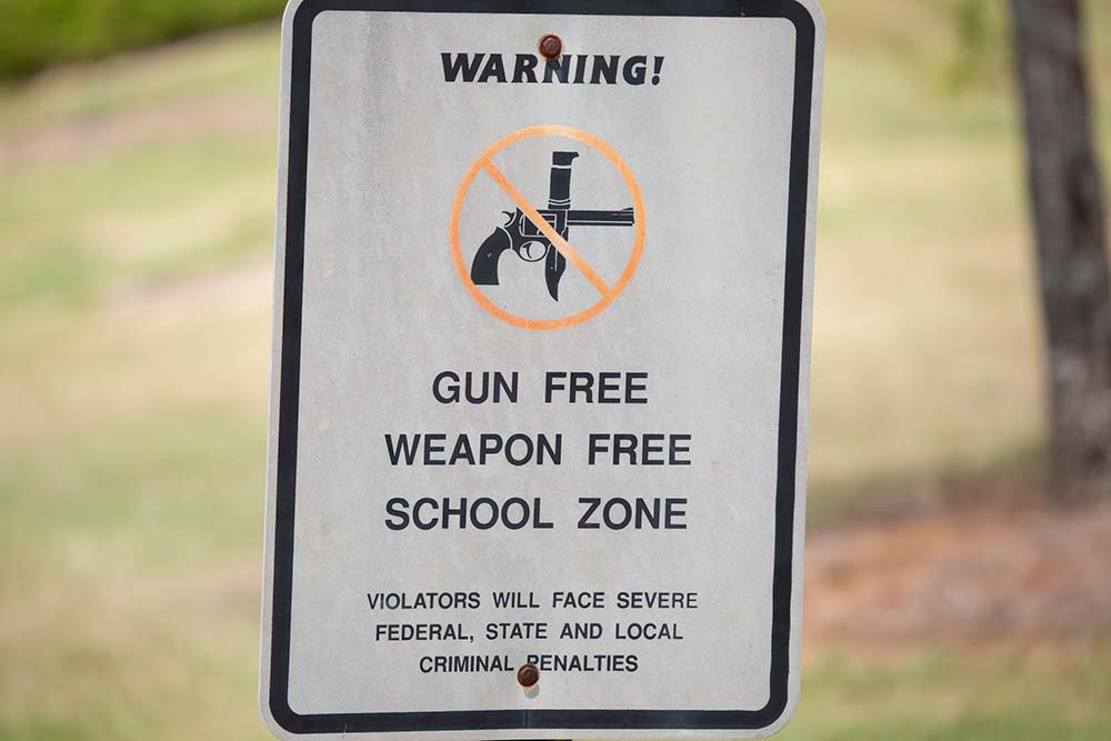 Gun-Free School Zone Act Challenge: Ninth Circuit Reverses Montana Indictment, iStock-1432295648
