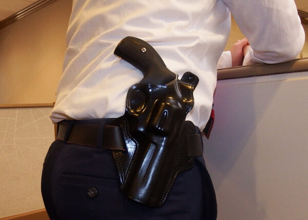 The revolver appears to be a Smith & Wesson
