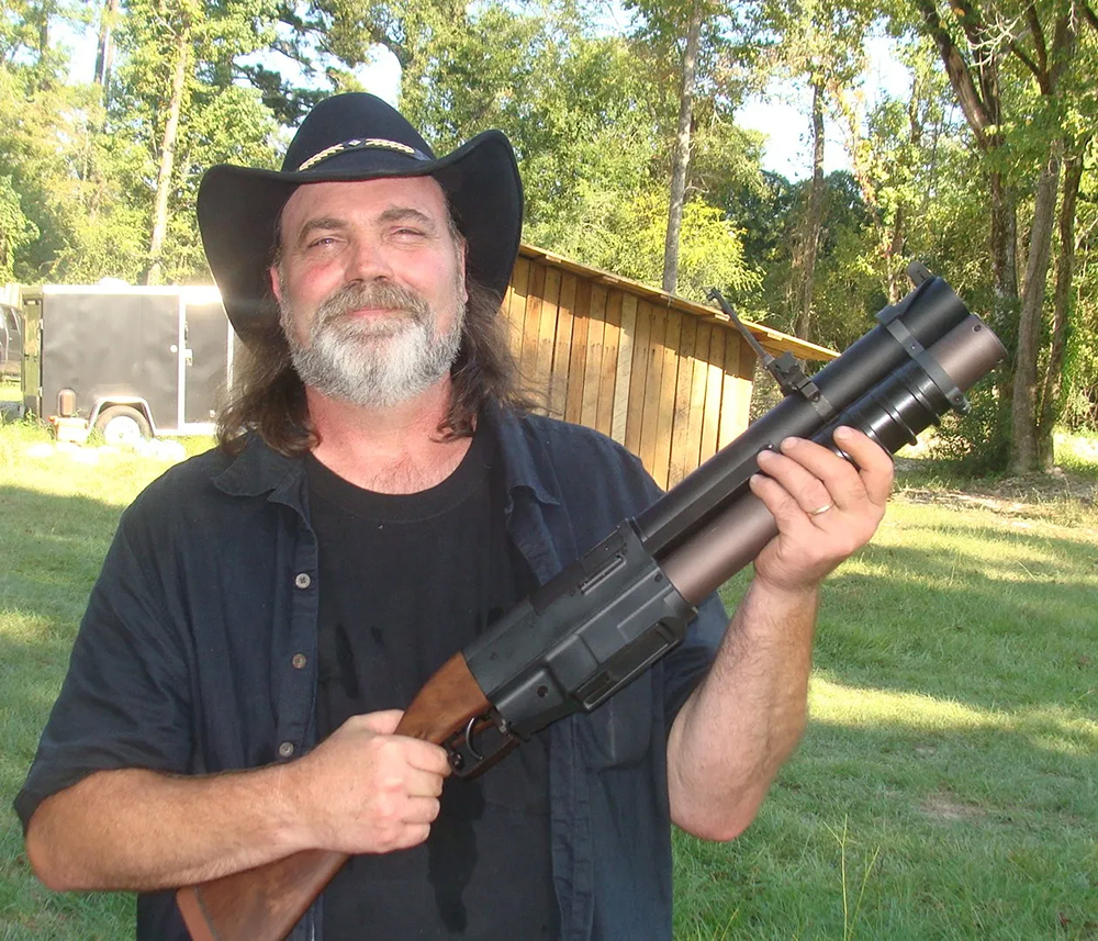 Georgia gunsmith and expert witness Len Savage with a 40mm “pumper-thumper” grenade launcher. (Photo courtesy Len Savage).