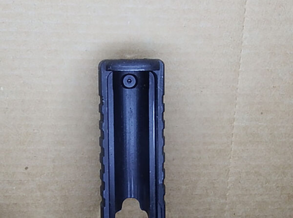 Underside of the PR57 front slide. An Allen wrench can loosen the nut holding on the front sight.