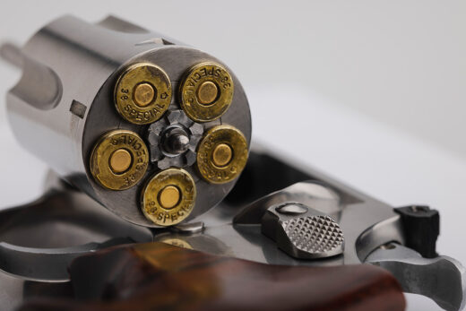 Close up of .38 special bullets and revolver iStock-1327774966