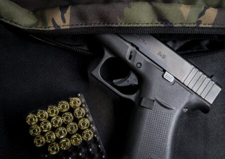 A Glock 48 in camouflage fanny pack