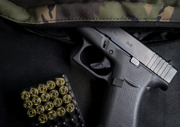 A Glock 48 in camouflage fanny pack
