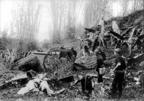 american troops lining up an artillery piece in the Philippines 