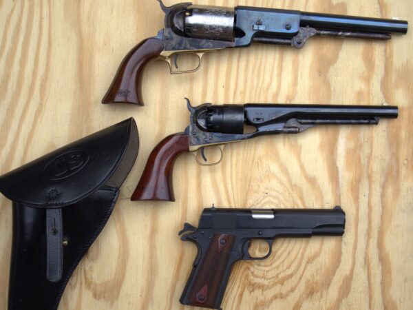 Colt 1911 next to Colt 1860 and Walker revolvers