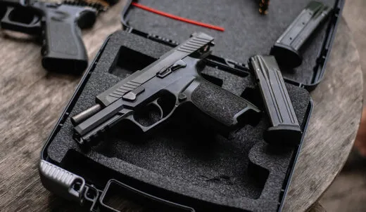 9mm pistol in case at a gun store.