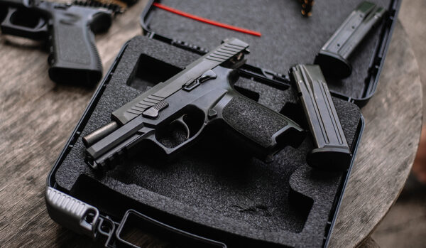 9mm pistol in case at a gun store.