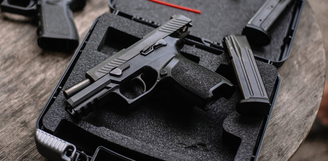 9mm pistol in case at a gun store.