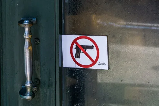 No-guns sign posted on a public transit door in Illinois
